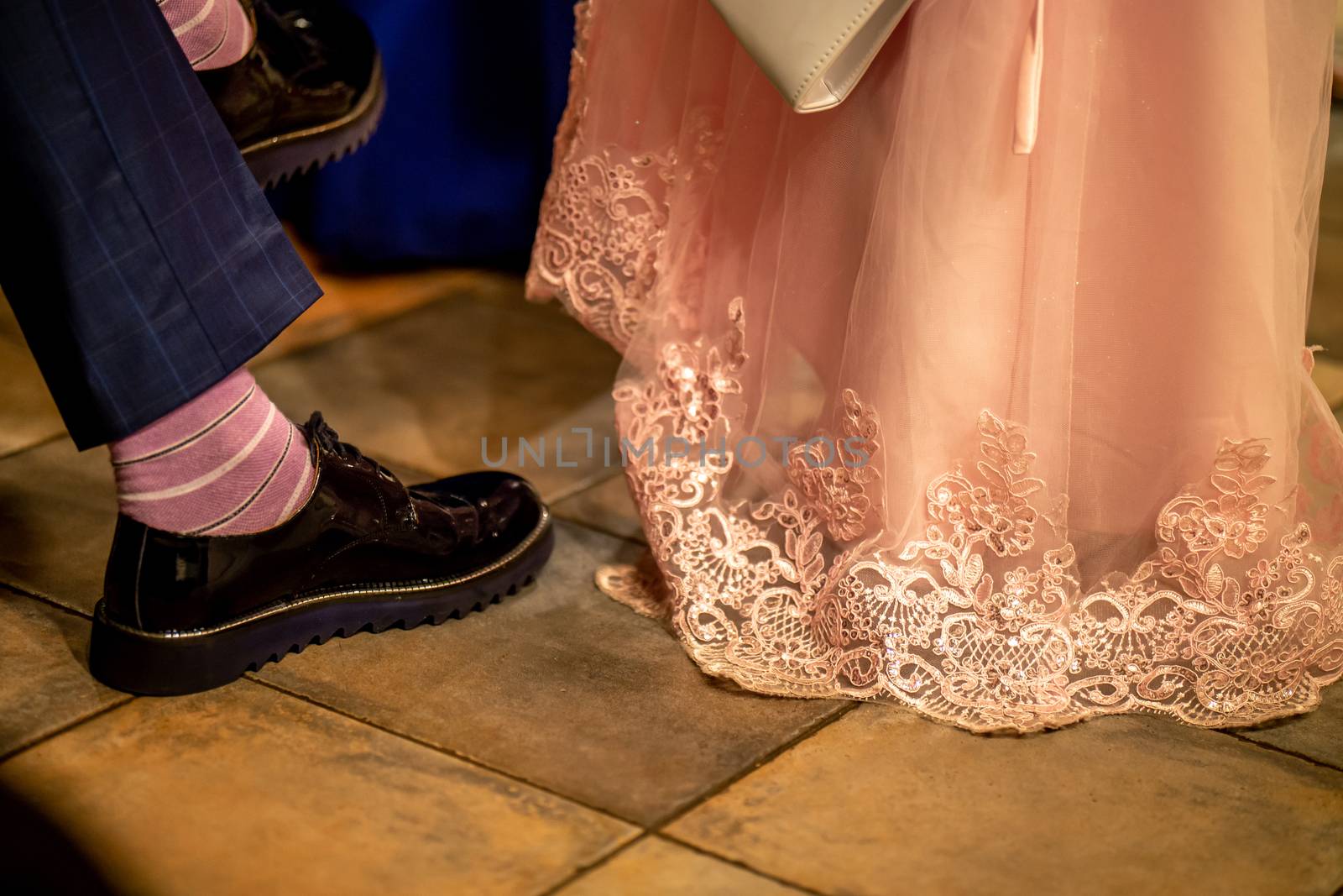 Bride and groom legs on floor by fotorobs