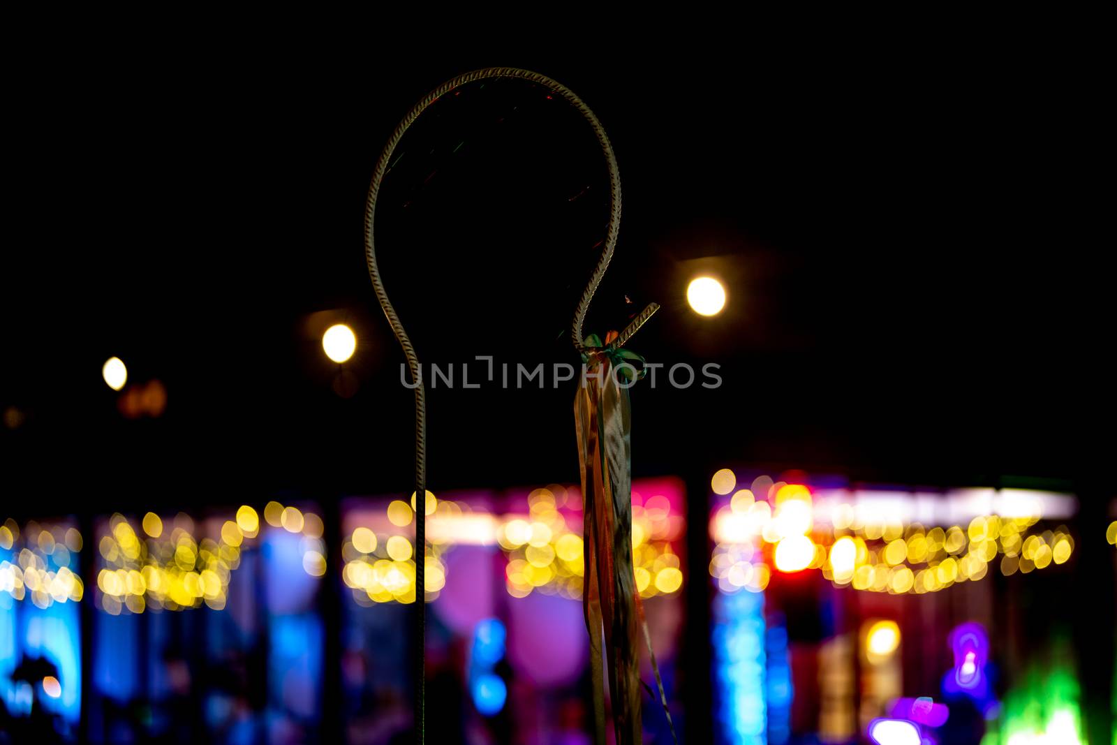 Wedding night decoration with ribbon. Decor for wedding party at night, in the light of colorful spotlights.