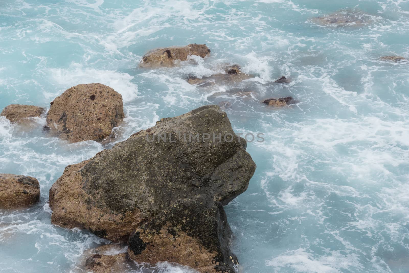 stones in the ocean and waves. beautiful azure landscape of Canary Islands