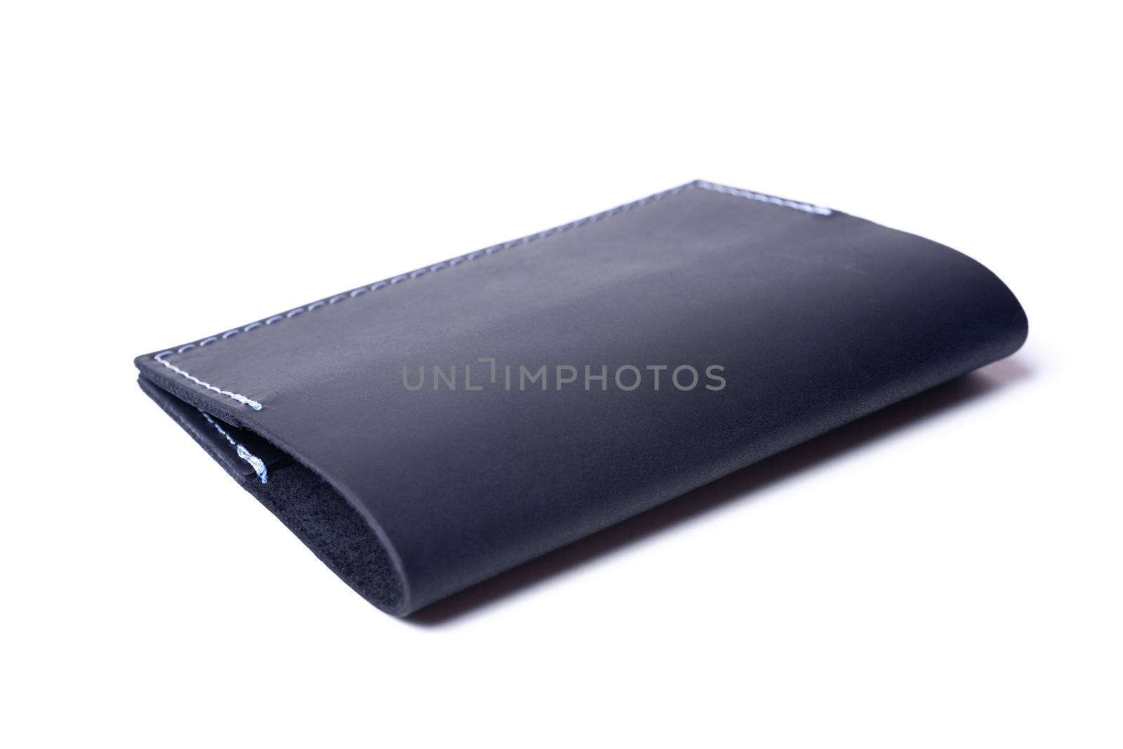 Blue handmade leather passport cover isolated on white background. Cover is closed. Stock photo of luxury businessman accessories.