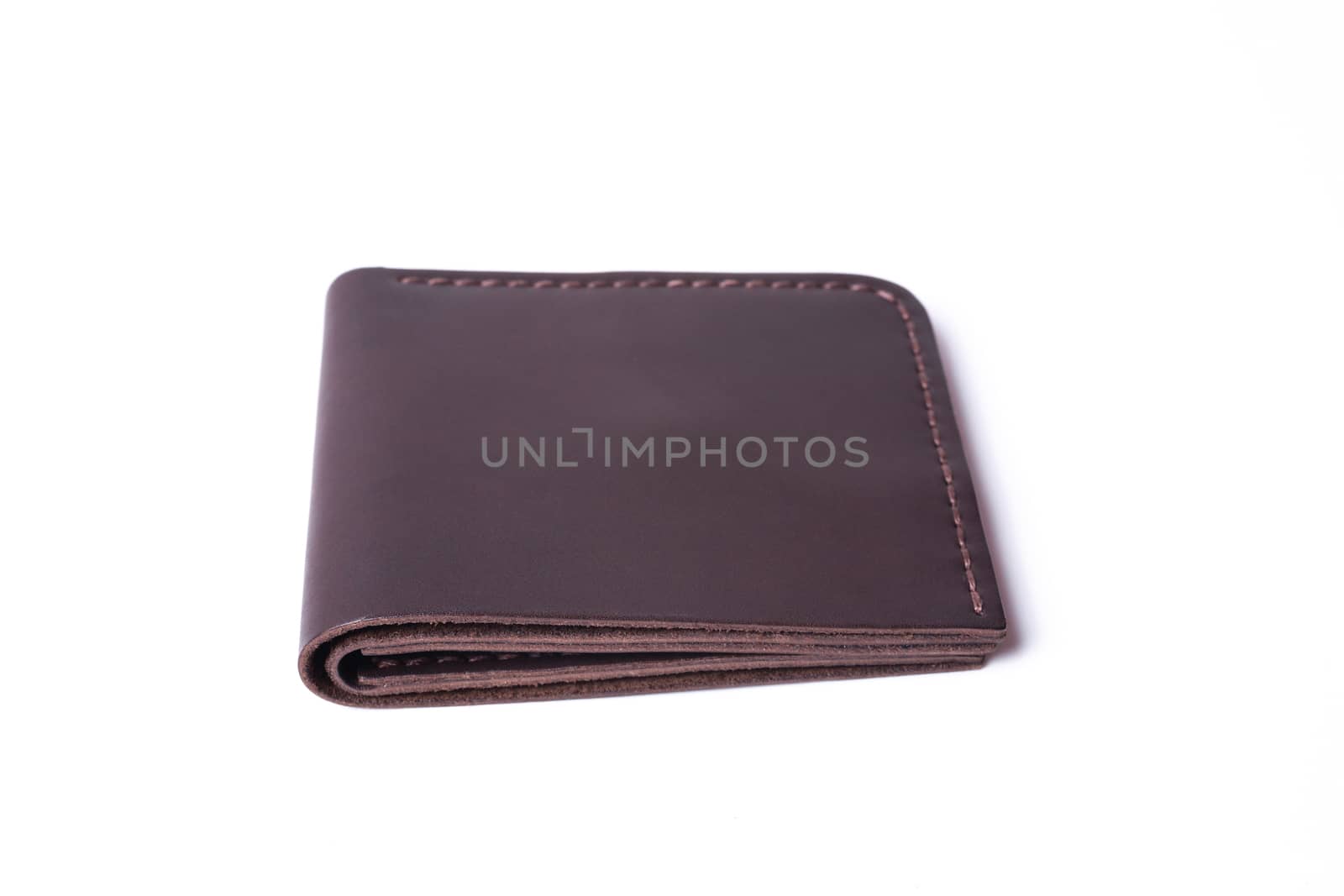 Brown handmade leather man wallet isolated on white background.  by alexsdriver