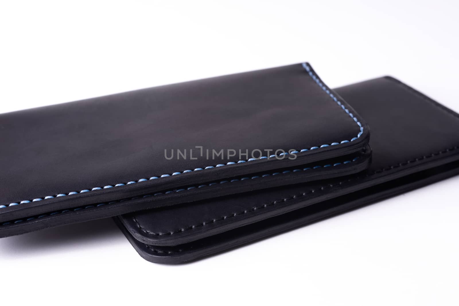 Two handmade leather black purse isolated on white background. S by alexsdriver