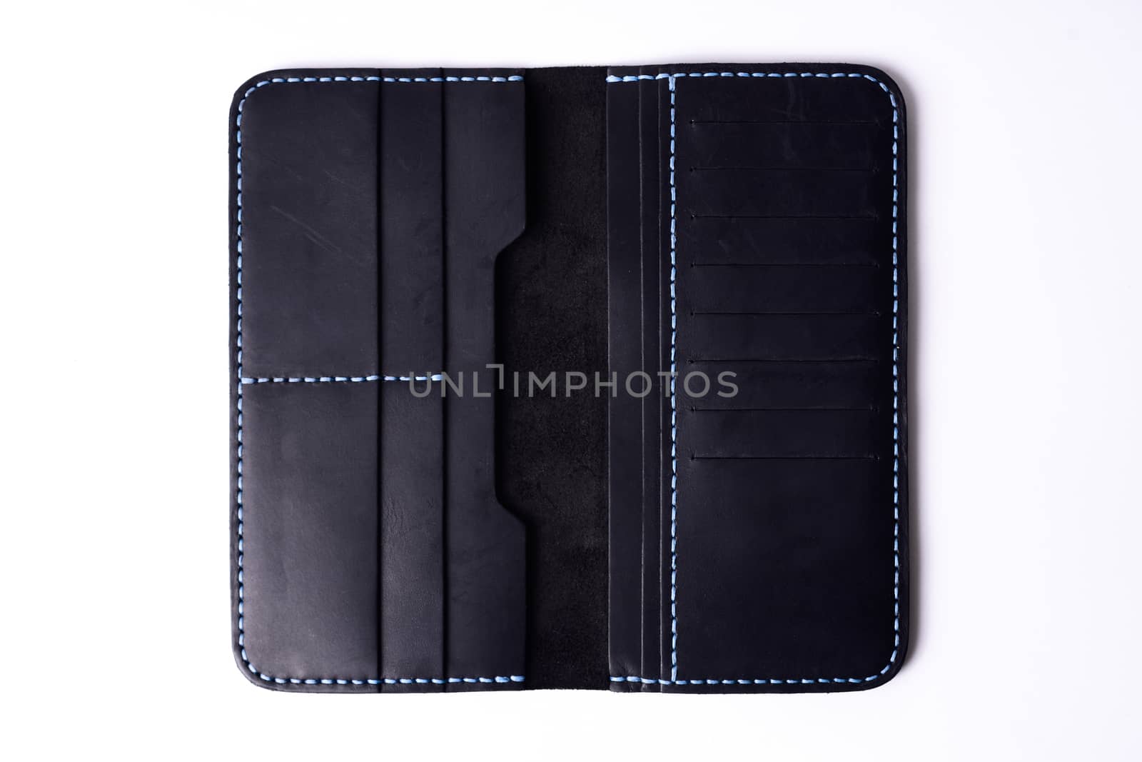 Two handmade black leather porte-monnaie isolated on white background. Stock photo of luxury accessories.