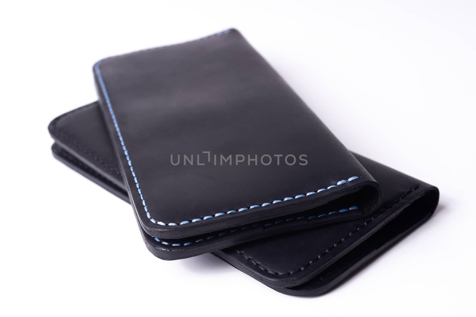 Two handmade leather black purse isolated on white background. Stock photo of luxury accessories.