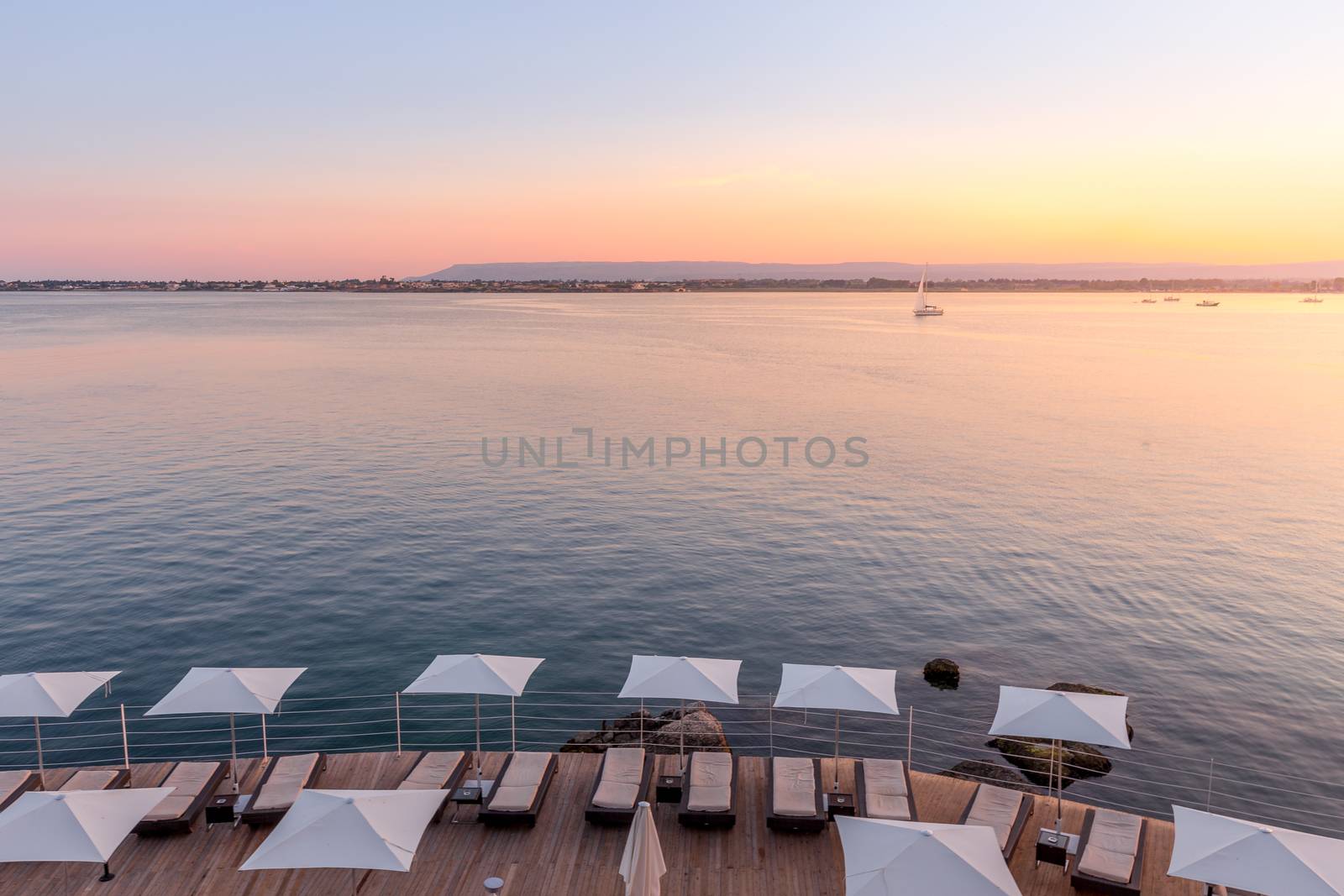 Syracuse, Isle of Sicily, Italy. Sunset in front of the sea at the end of a spring day in May.