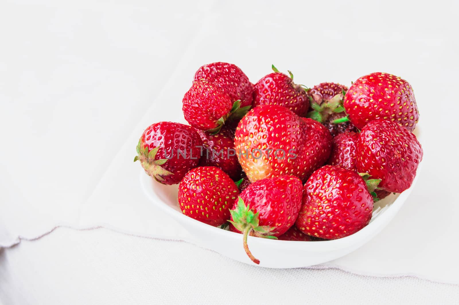 Glass bowl with fresh ripe strawberries, space for text, copy space, white background, mockup by claire_lucia