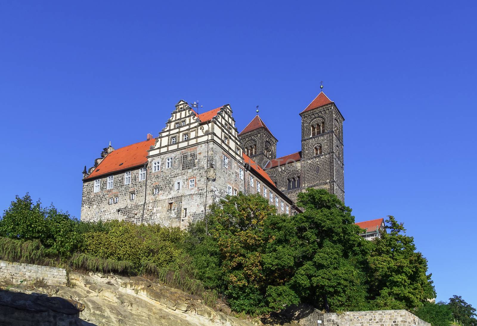 Castle in Quedlinburg settles down on the mountain and towers over the city, Germany. 