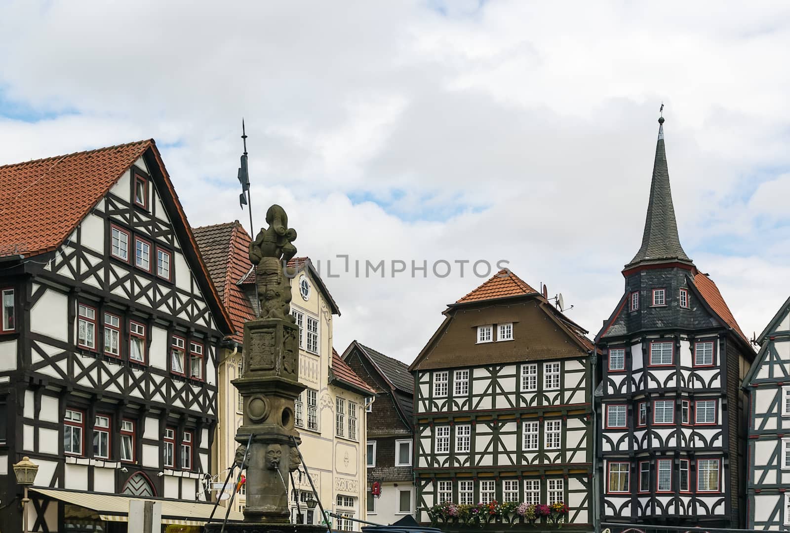 the street with picturesque ancient half-timbered houses in the Fritzlar city, Germany