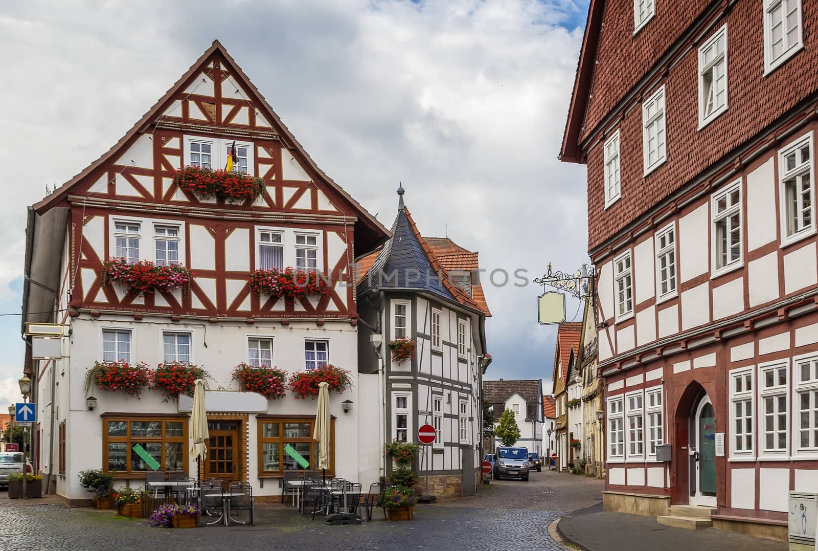 the street with picturesque ancient half-timbered houses in the Fritzlar city, Germany