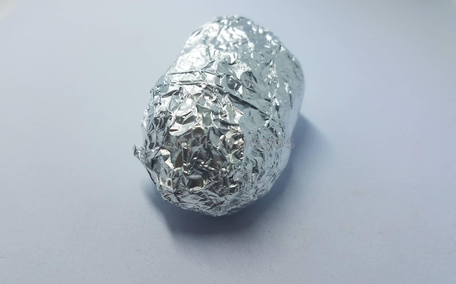object wrapped in foil on white background by stockphotofan1