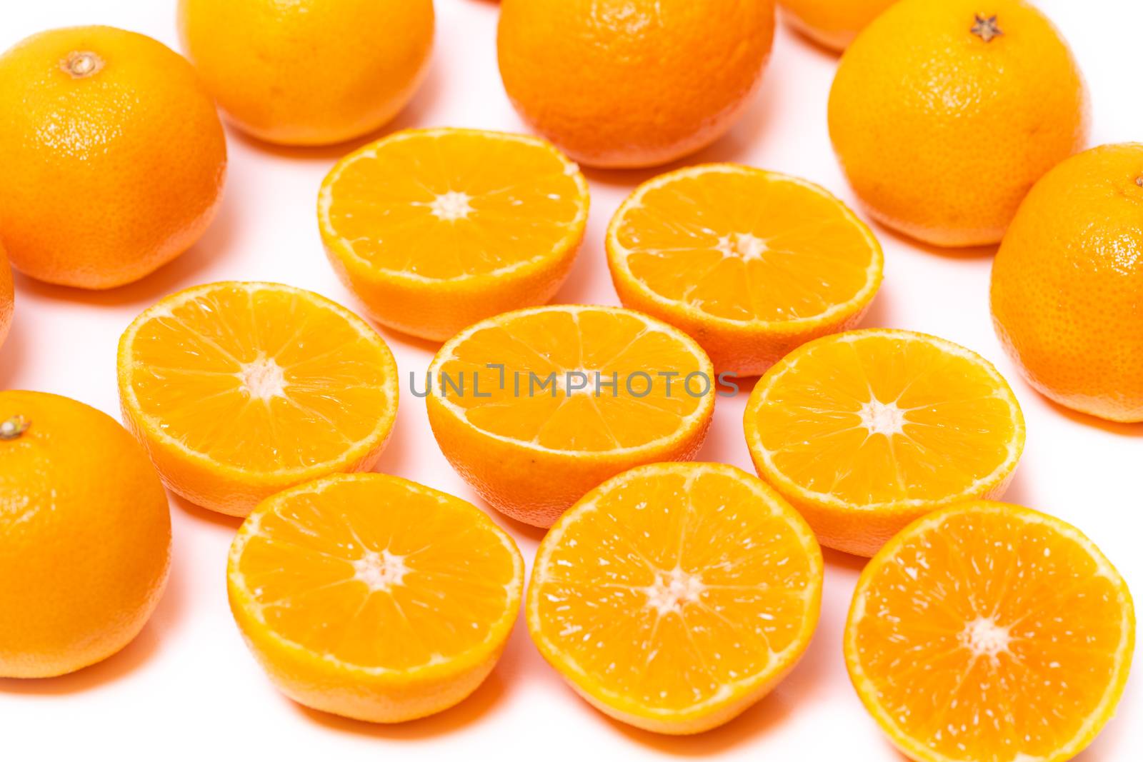 Set of round cut slices of ripe juicy organic mandarin oranges on a white background. Vitamins healthy lifestyle vegan super foods concept.