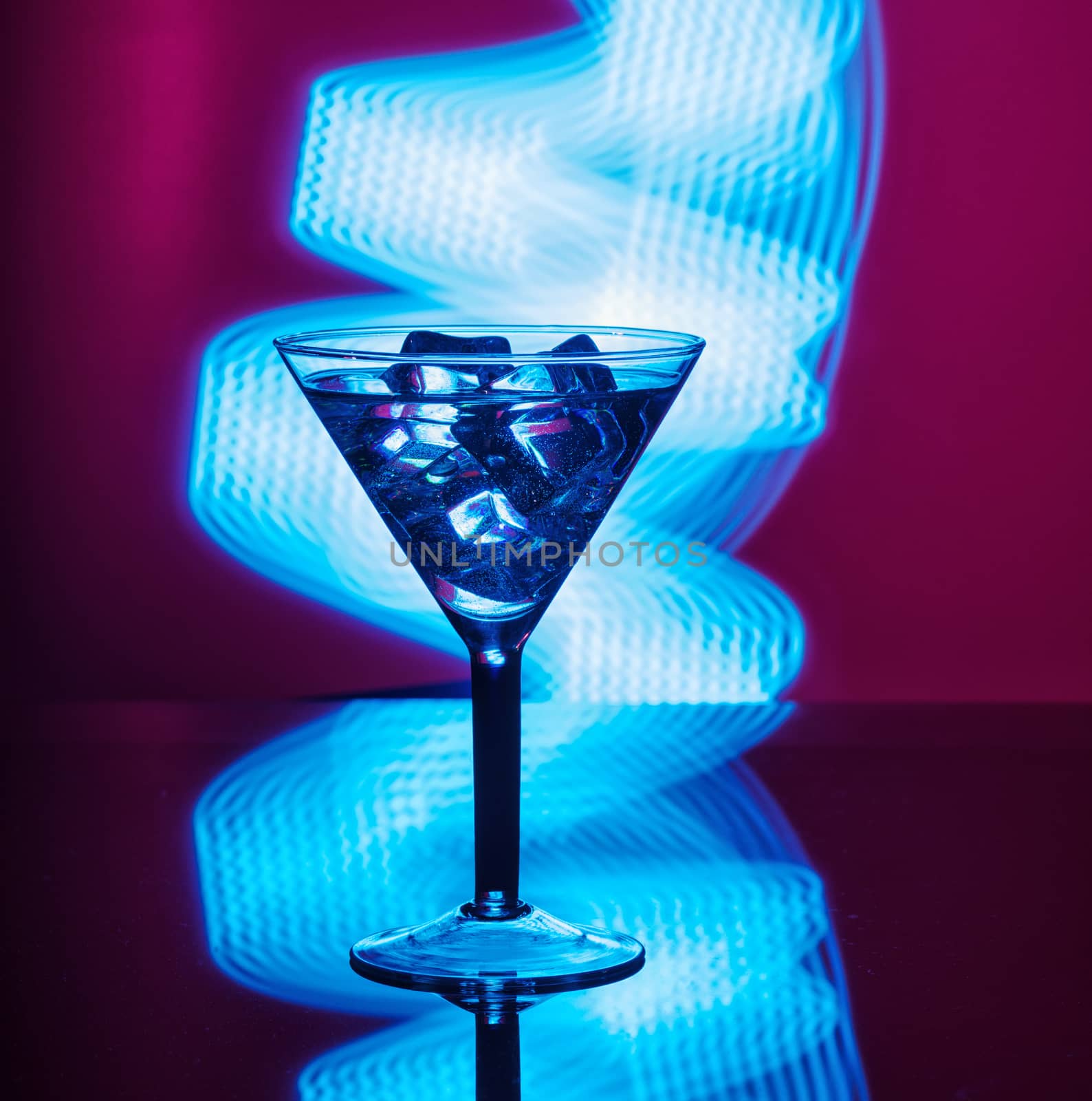 A glass of martini glass with club background by dmitry_derenyuk