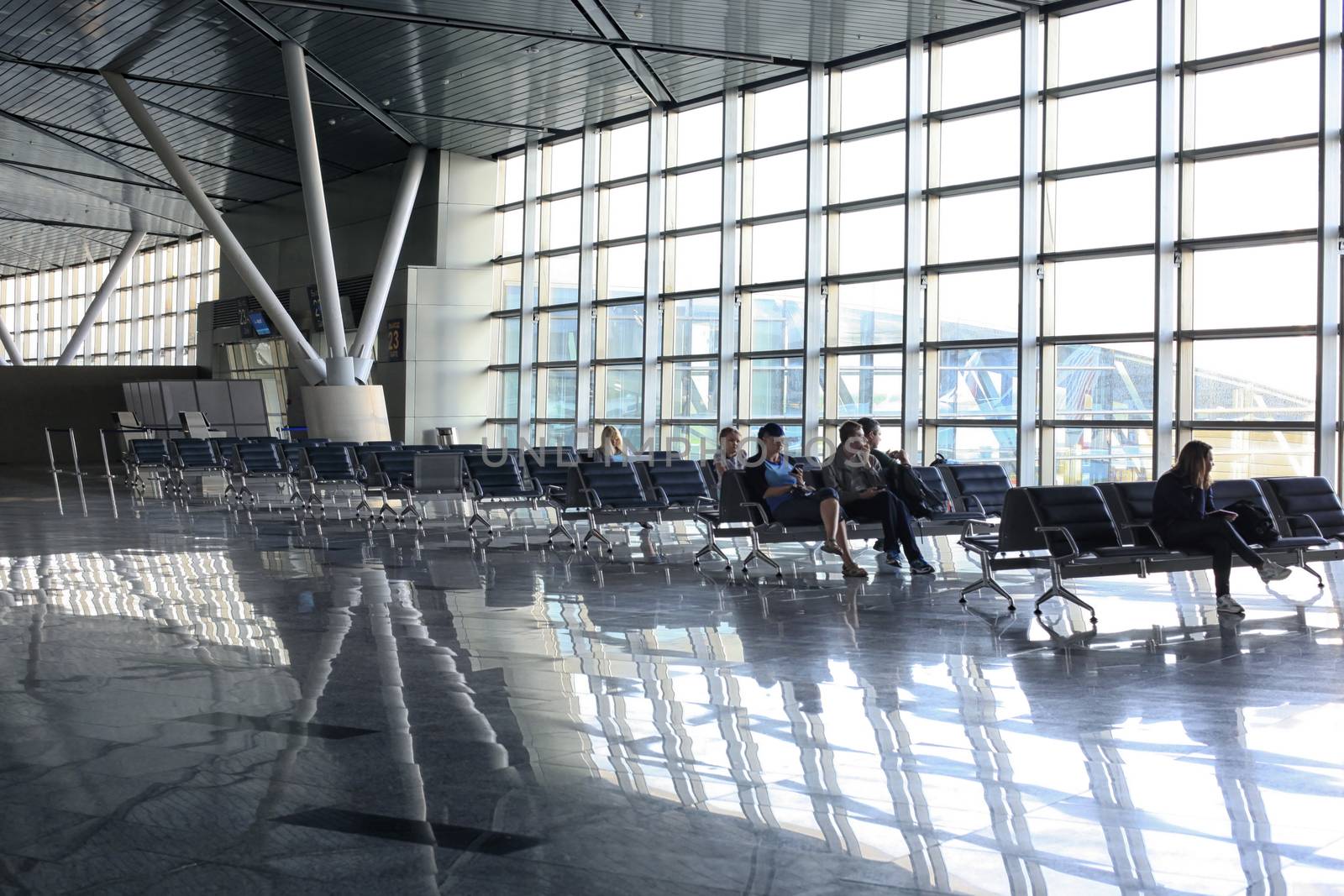 People waiting for their flight at Vnukovo Airport, Moscow by friday