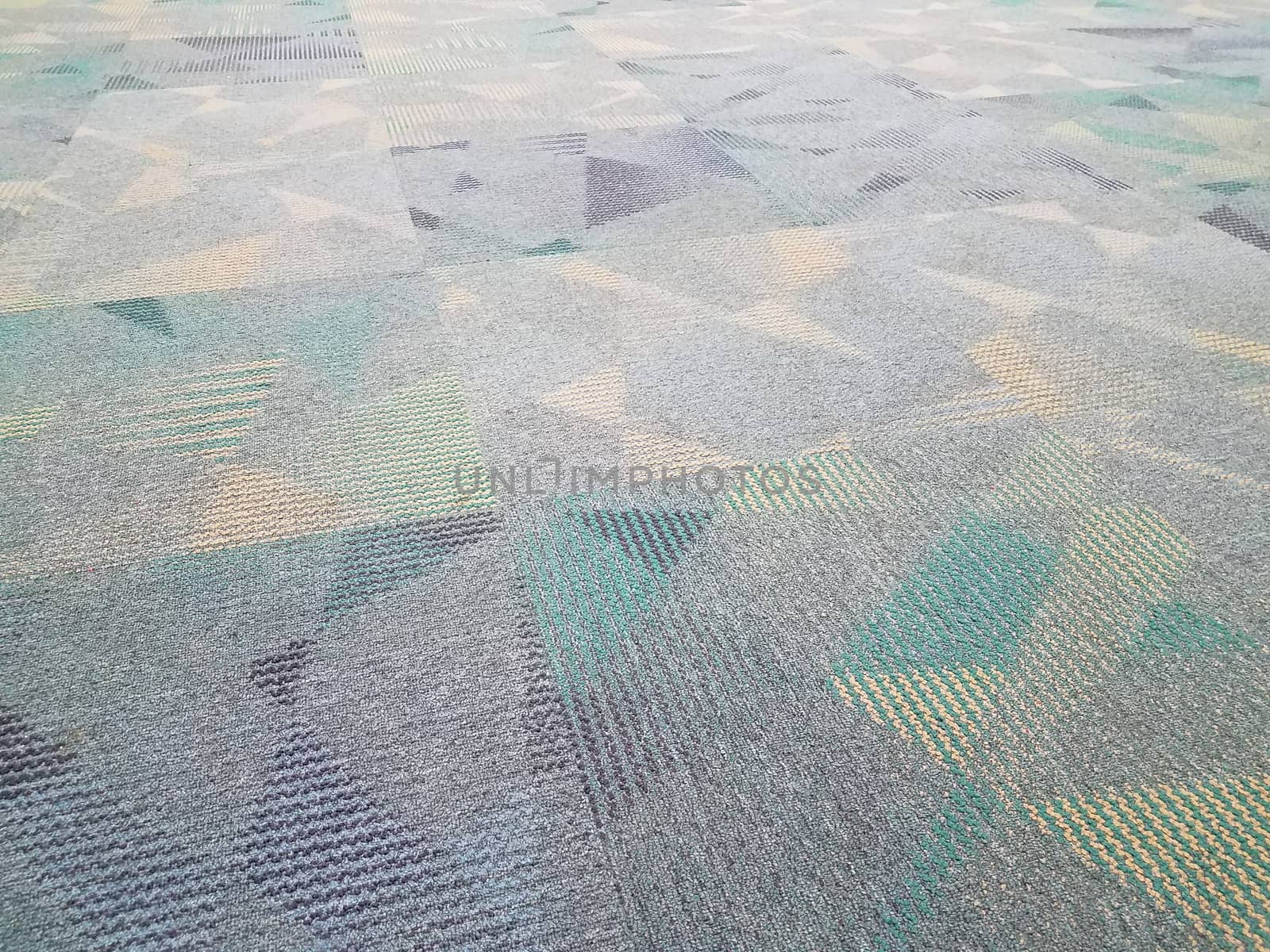 blue and grey carpet or rug with triangles and colors