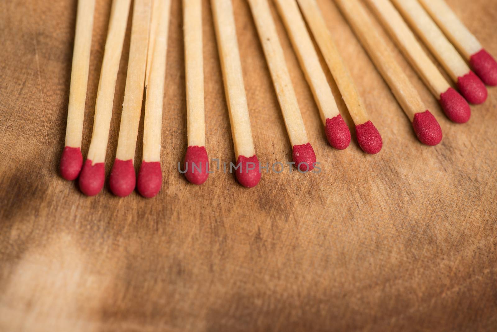 Matches on wooden table background with copy space.