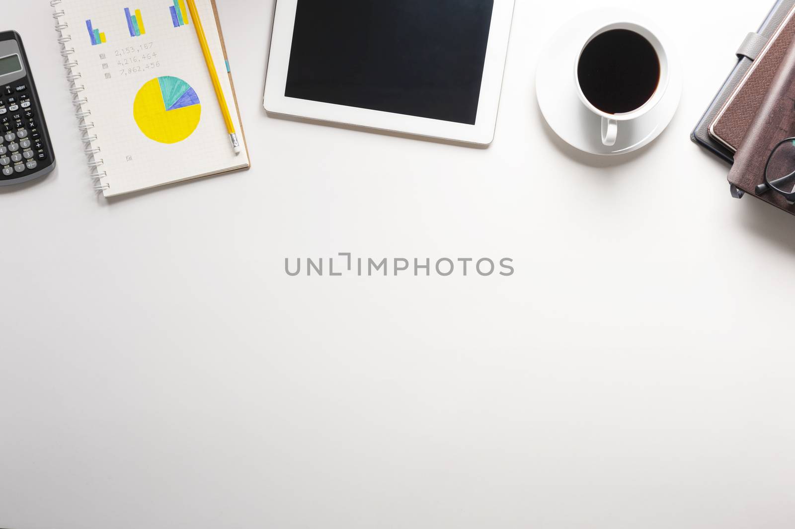 Top view of tablet, notebook, a cup of coffee on white backgroun by zendograph