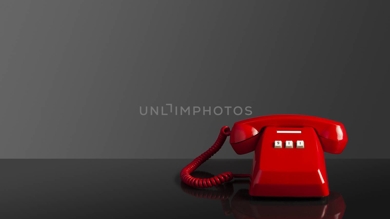 Emergency call 911 on the telephone, red old vintage telephone on black background and mirror desk, emergency call concept. 