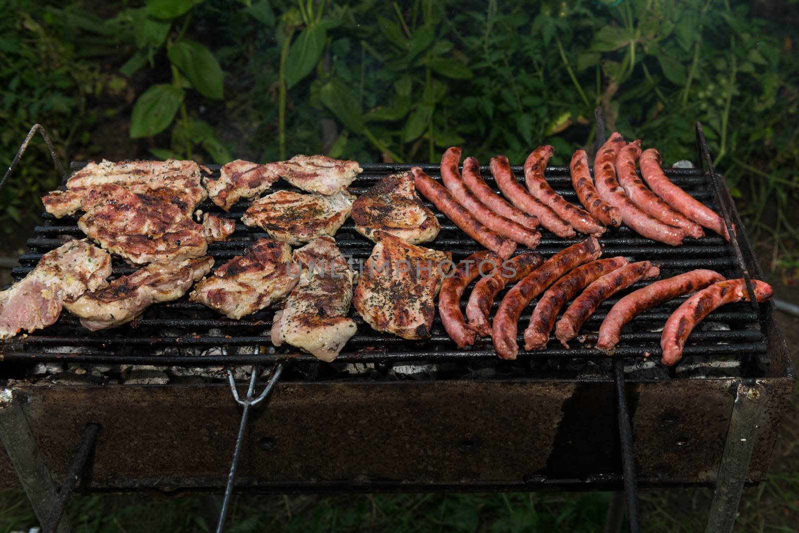 Grilled meats outdoors by viscorp