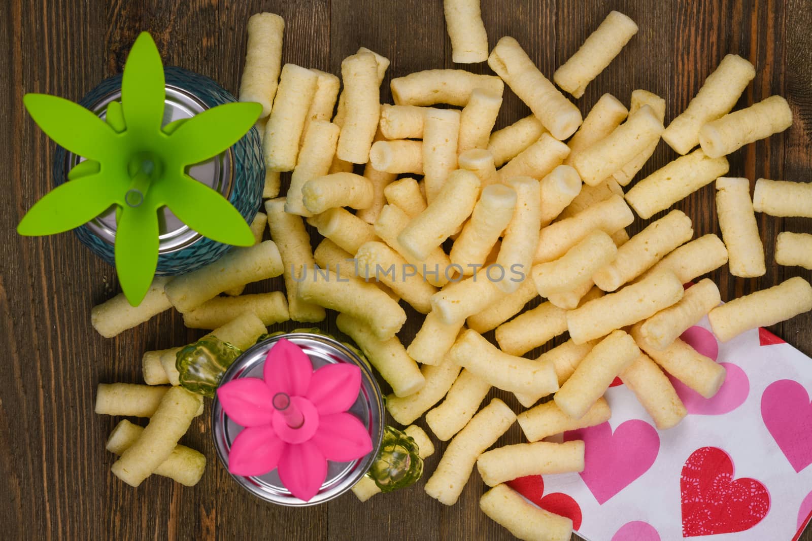 Corn puffs snack food texture background, close up detail.