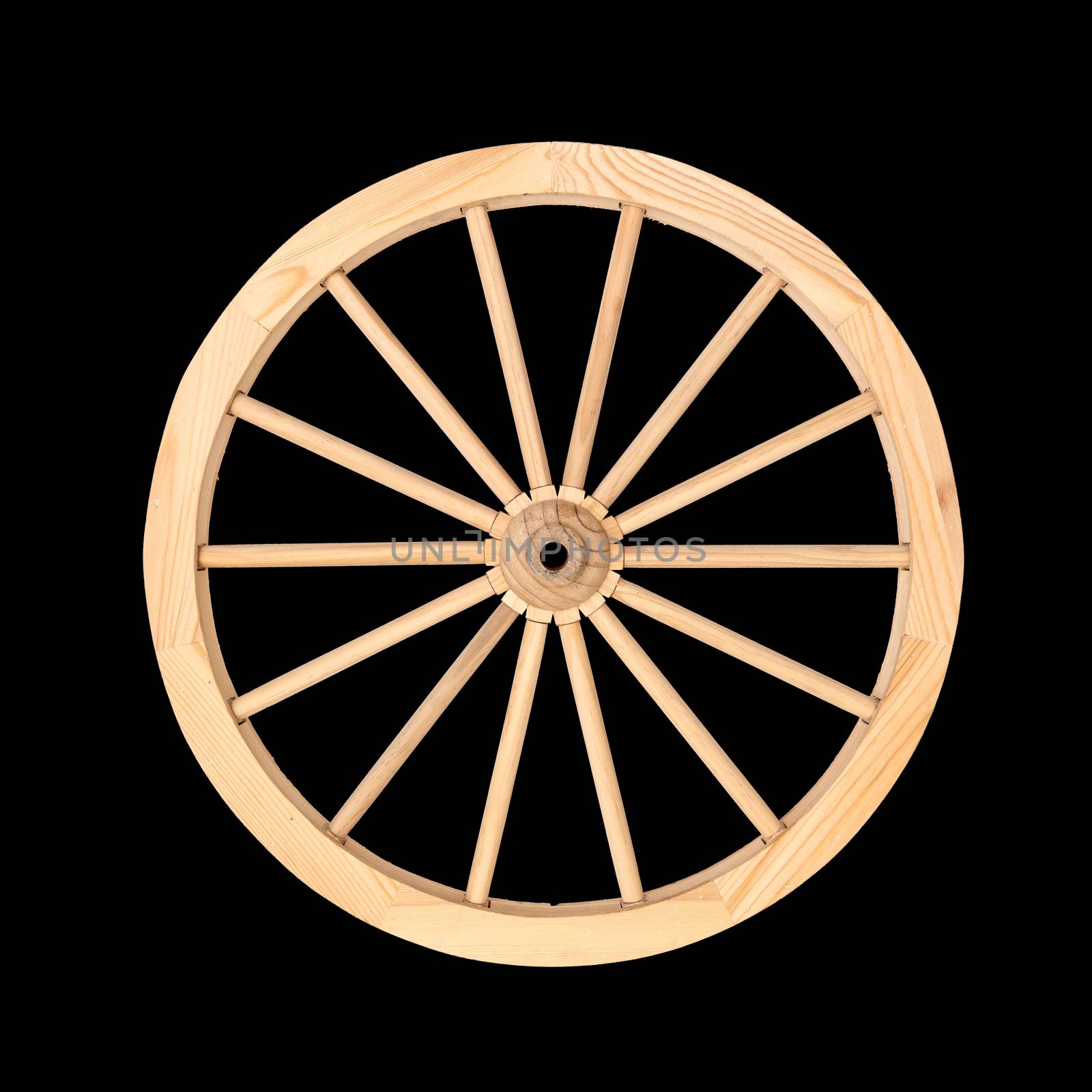 Clean wooden wheel from a cart used for decoration purposes isolated on a black background.