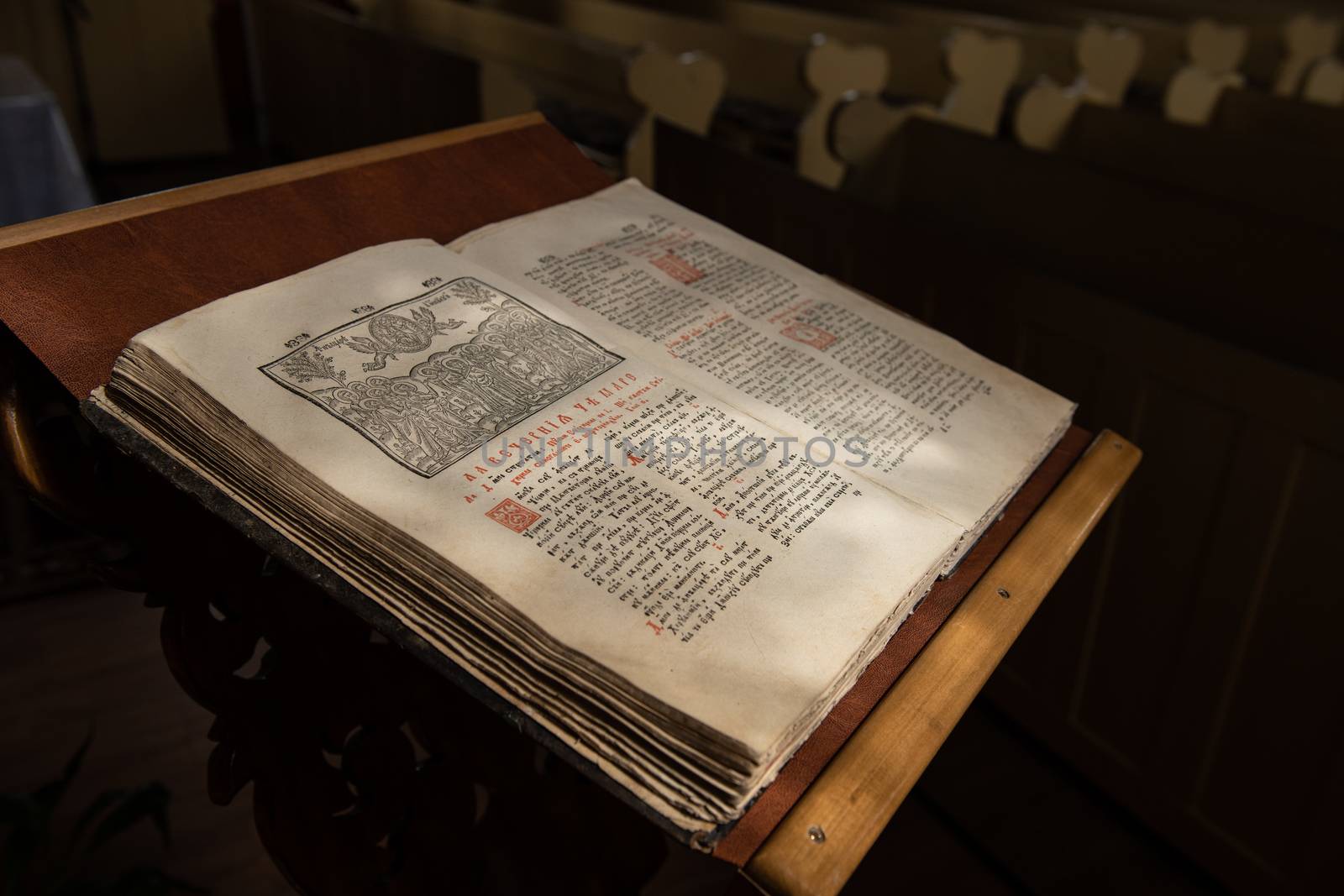 Old Christian manuscript written in Cyrillic on church pulpit.