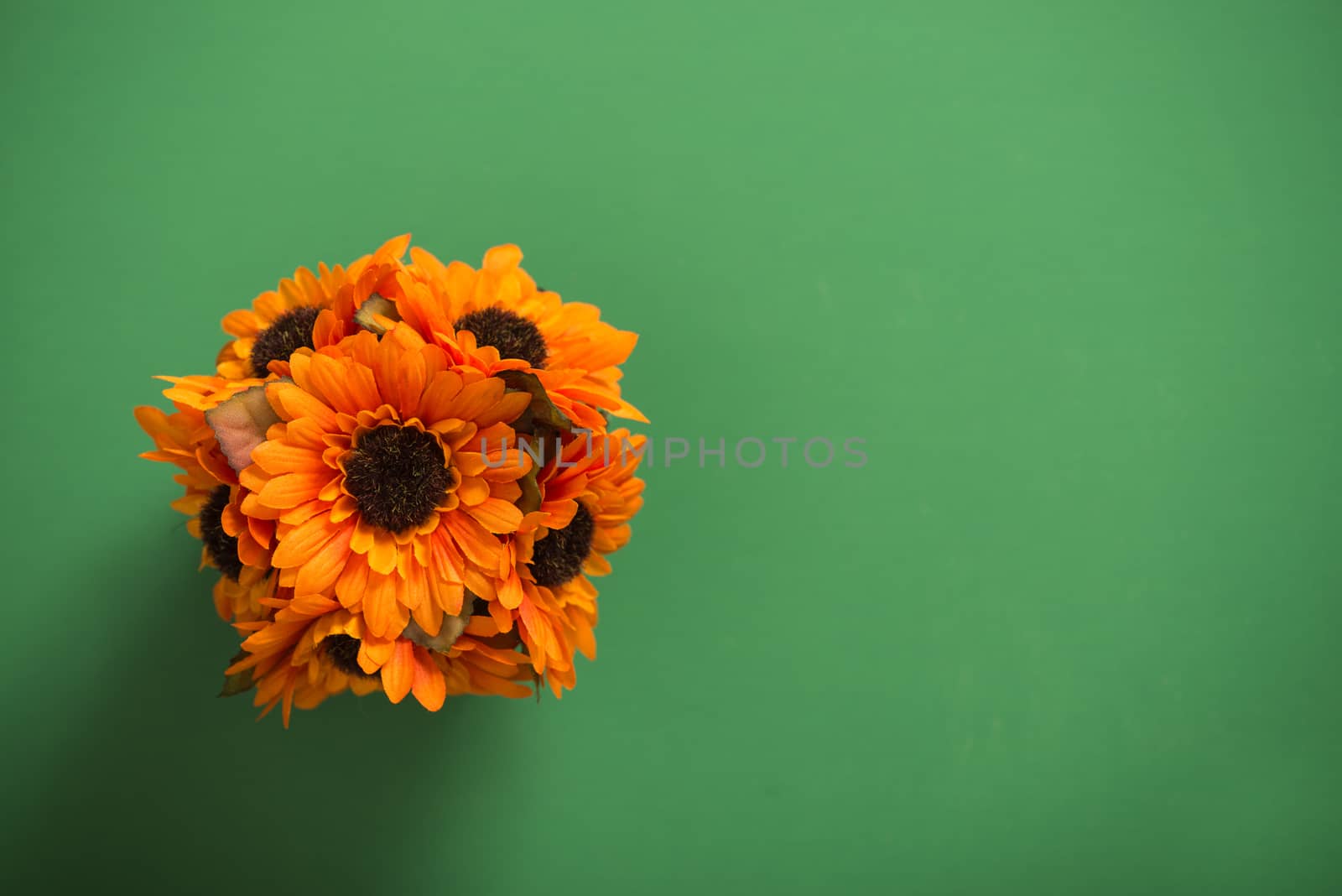 Reusable artificial flowers made from cloth and plastic.