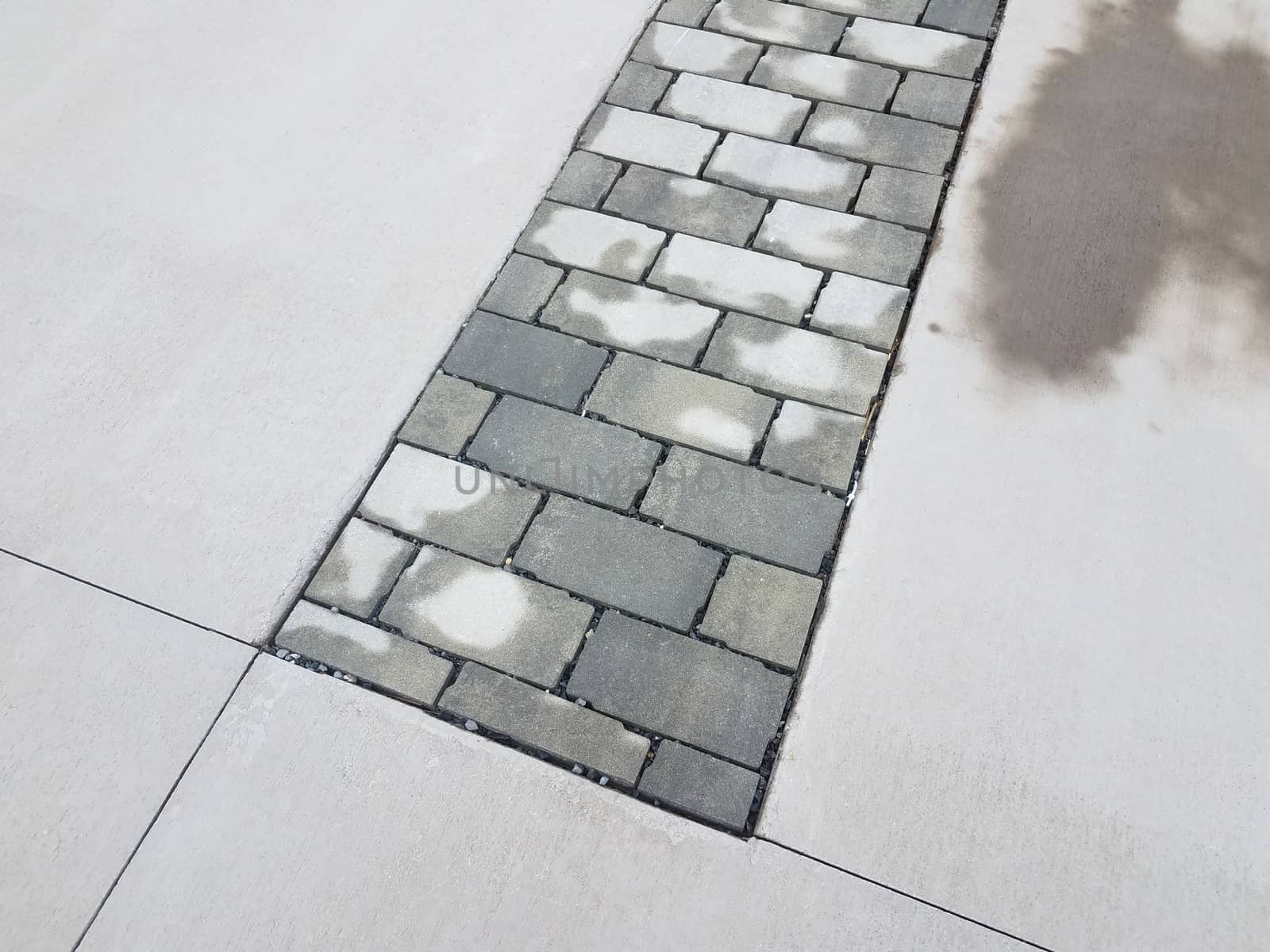 wet white and grey stone bricks and cement ground