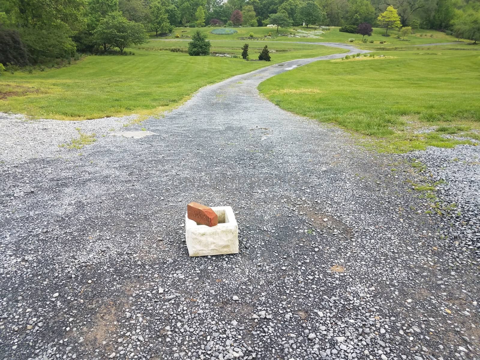 long gravel path with cinder block and brick by stockphotofan1