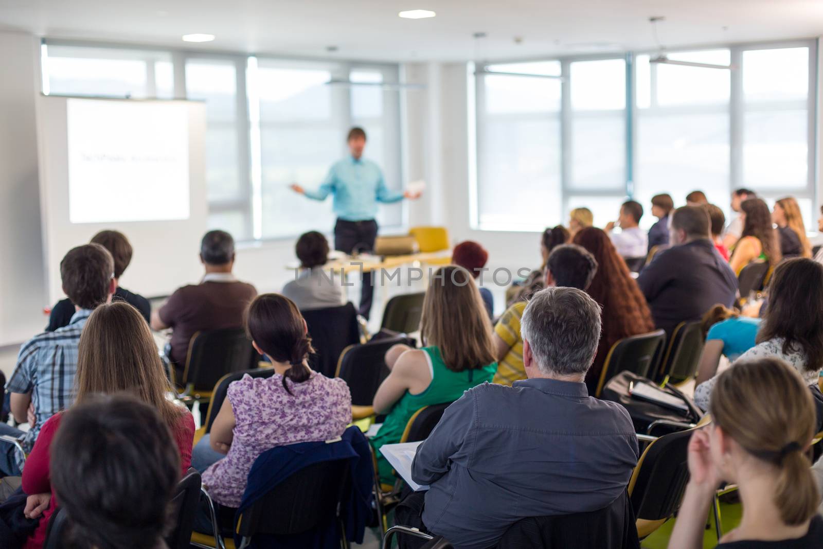 Speaker giving presentation on business conference. by kasto