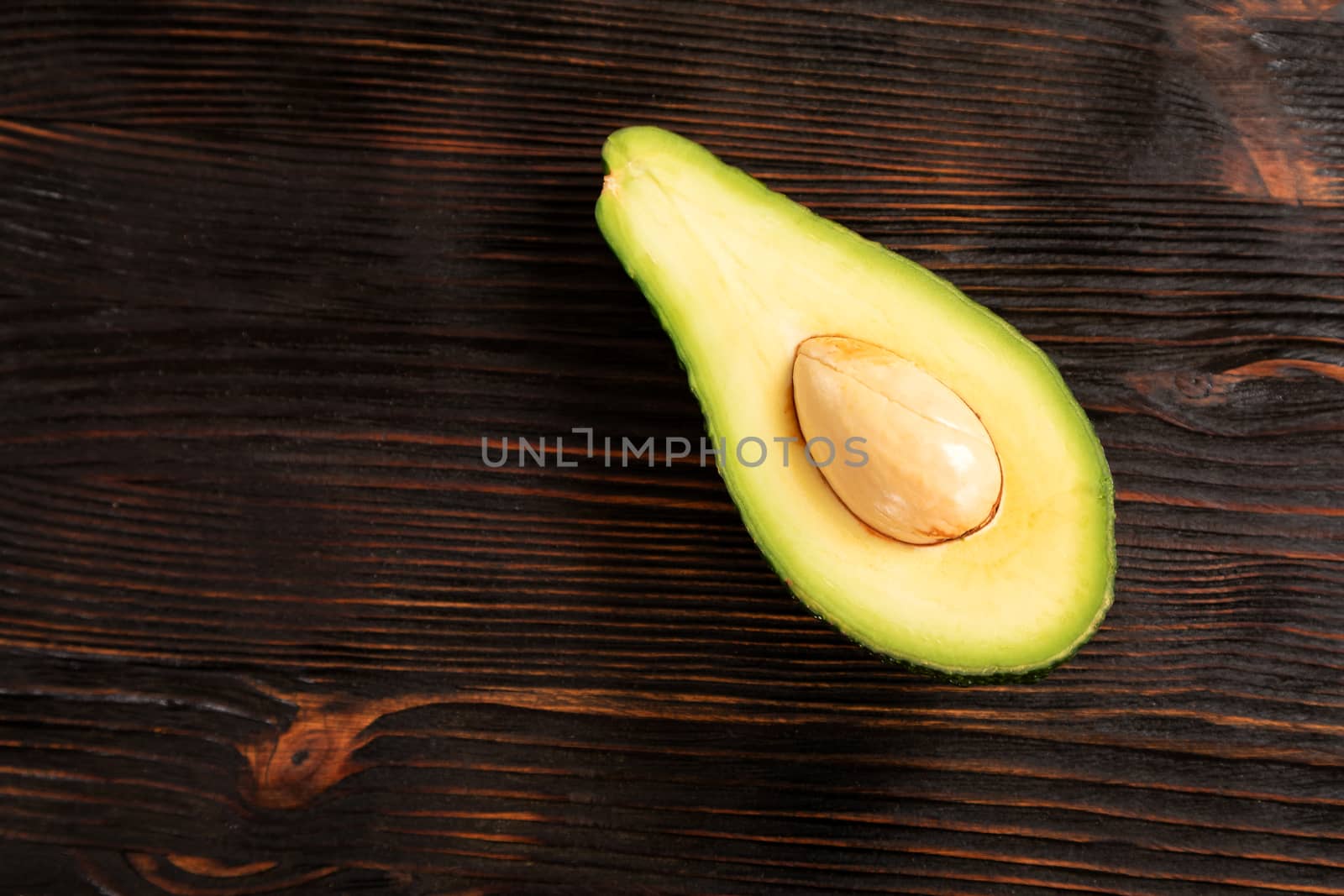 avocado on a cutting board by sveter