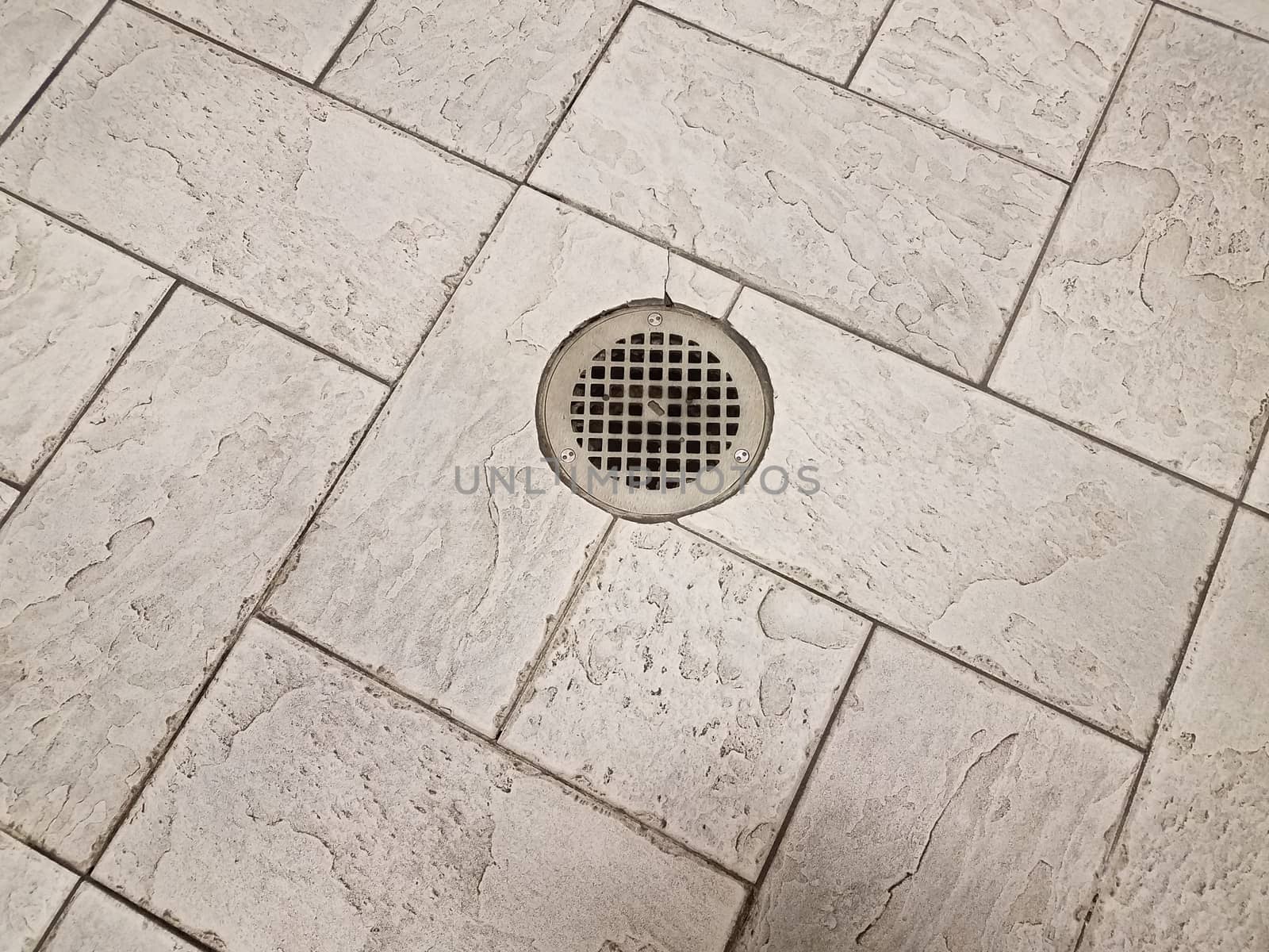 grey floor tiles with metal drain on ground by stockphotofan1