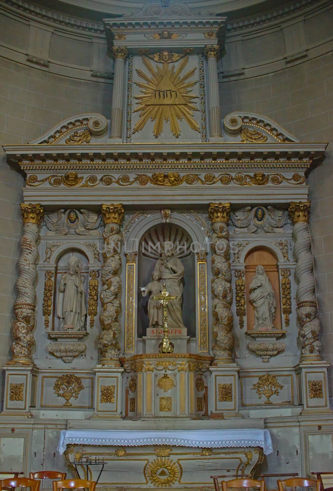 Altar with statues of saints in Catholic cathedral at Avranches, France