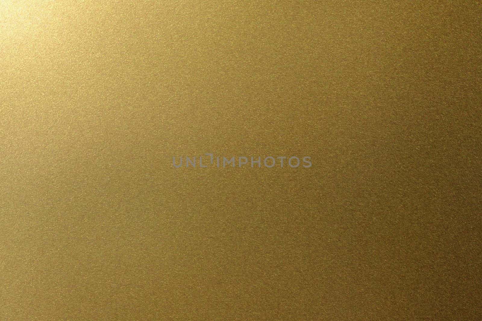 Light shining on golden metal plate, abstract texture background