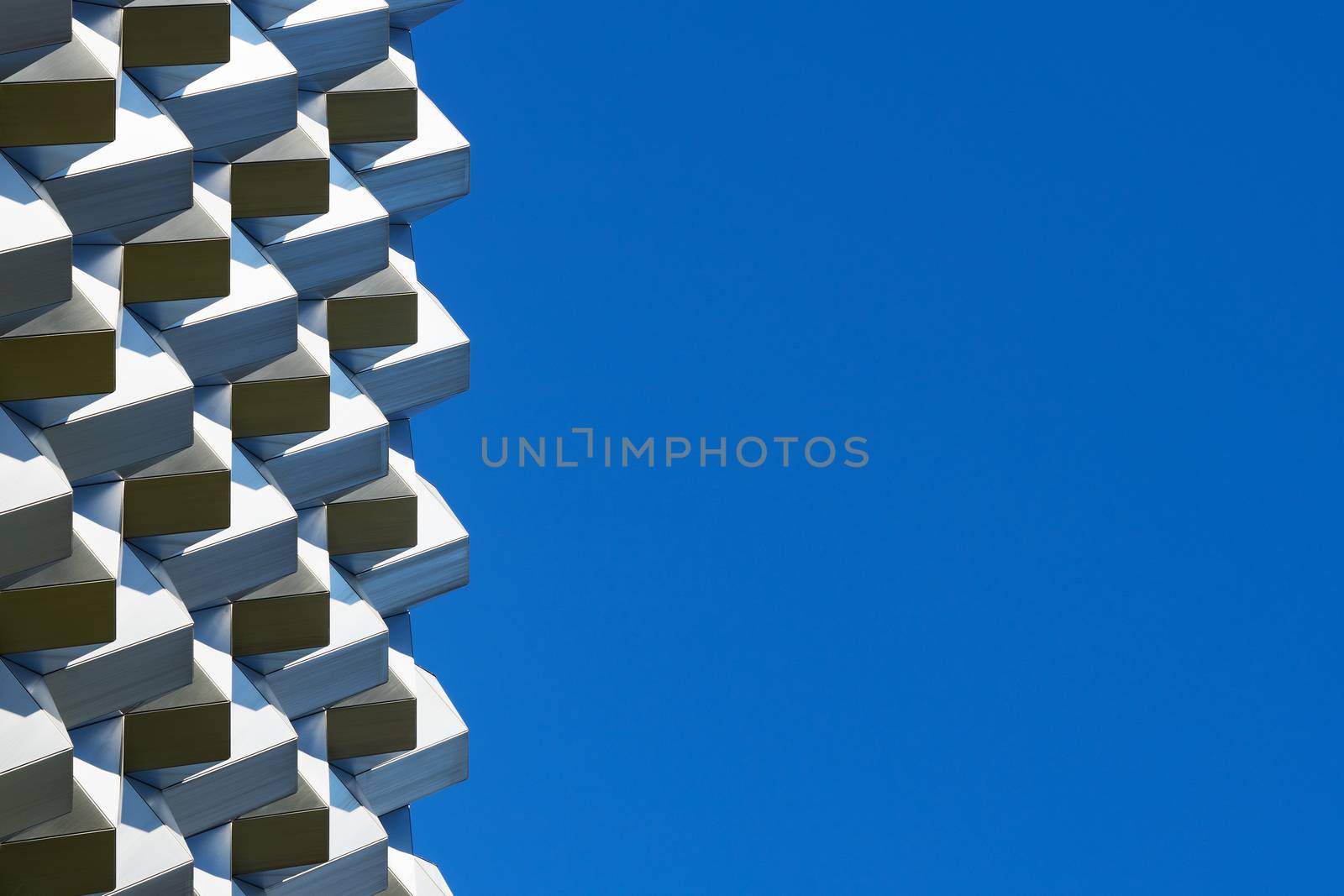 Roof structure seen against the clear blue sky on a sunny day.