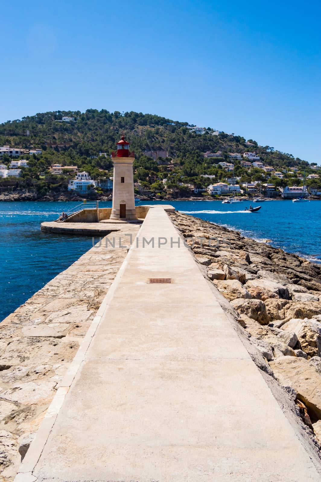 Throw to the lighthouse at the port of Andratx, north west of Palma de Mallorca, Spain