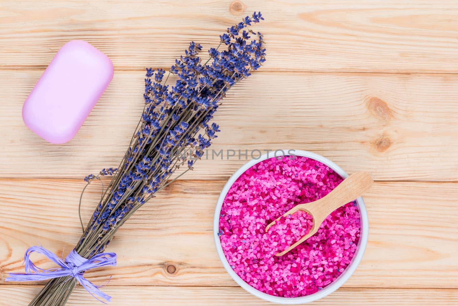 sea salt and soap with lavender extract for a bath on the boards objects top view close-ups