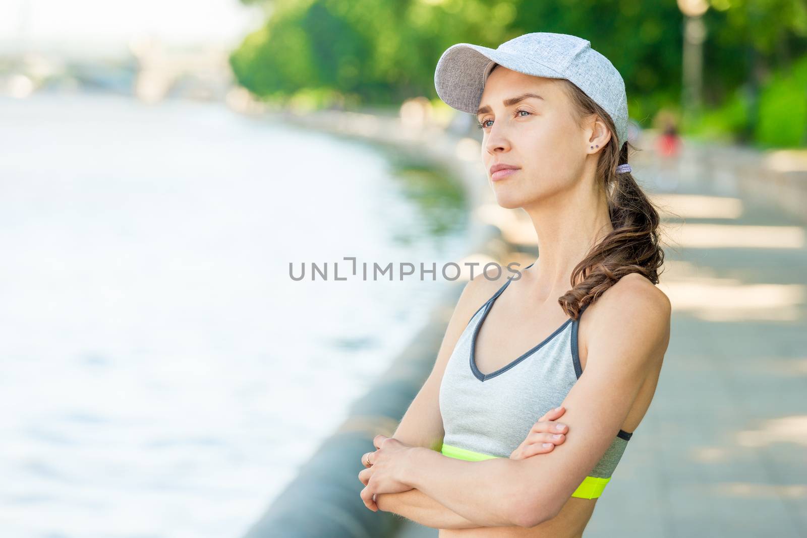 Vertical close-up portrait of a dreamy sportswoman who is posing by kosmsos111