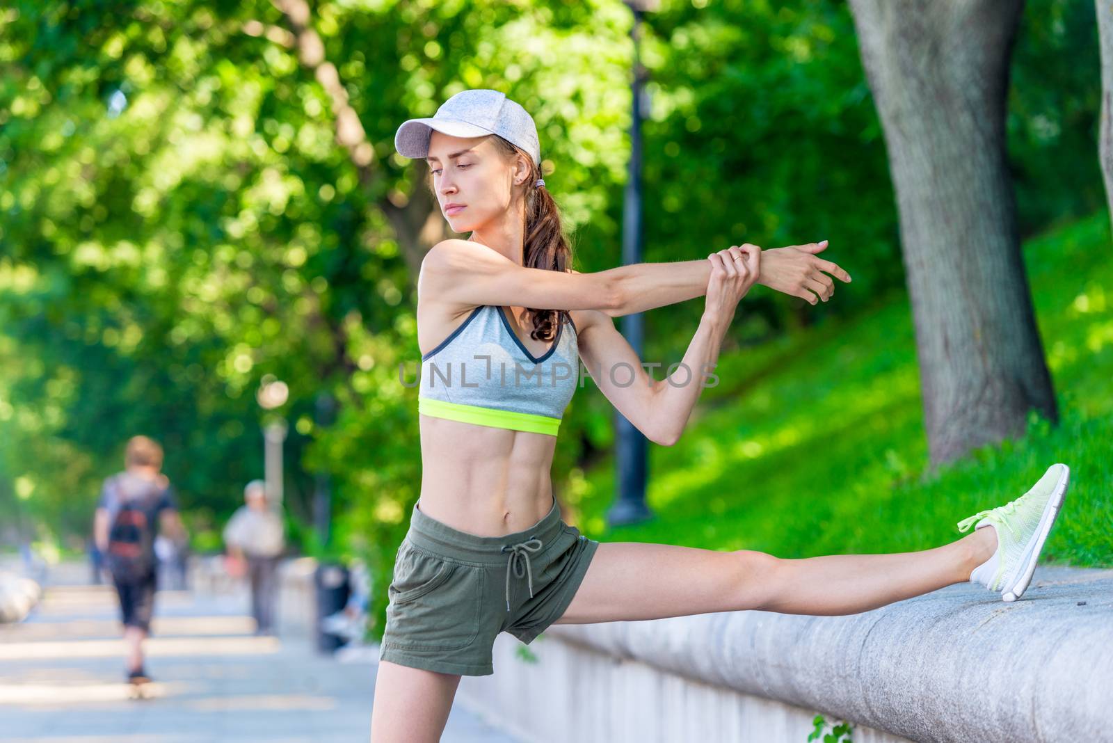 slender woman athlete warming up before jogging in a city park, by kosmsos111