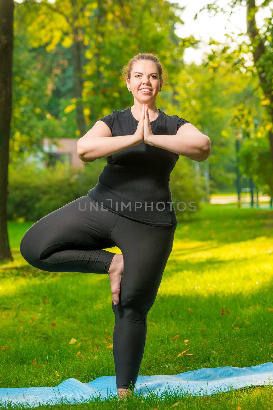 Obese girl stretches in park, daily routine for losing weight, d by kosmsos111