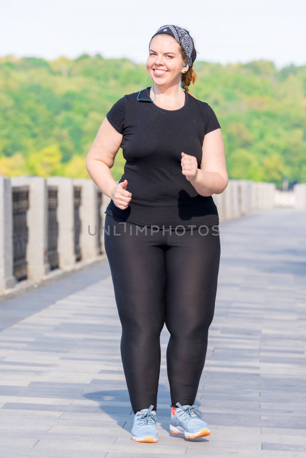 fat active woman working on her figure - morning run in the city by kosmsos111