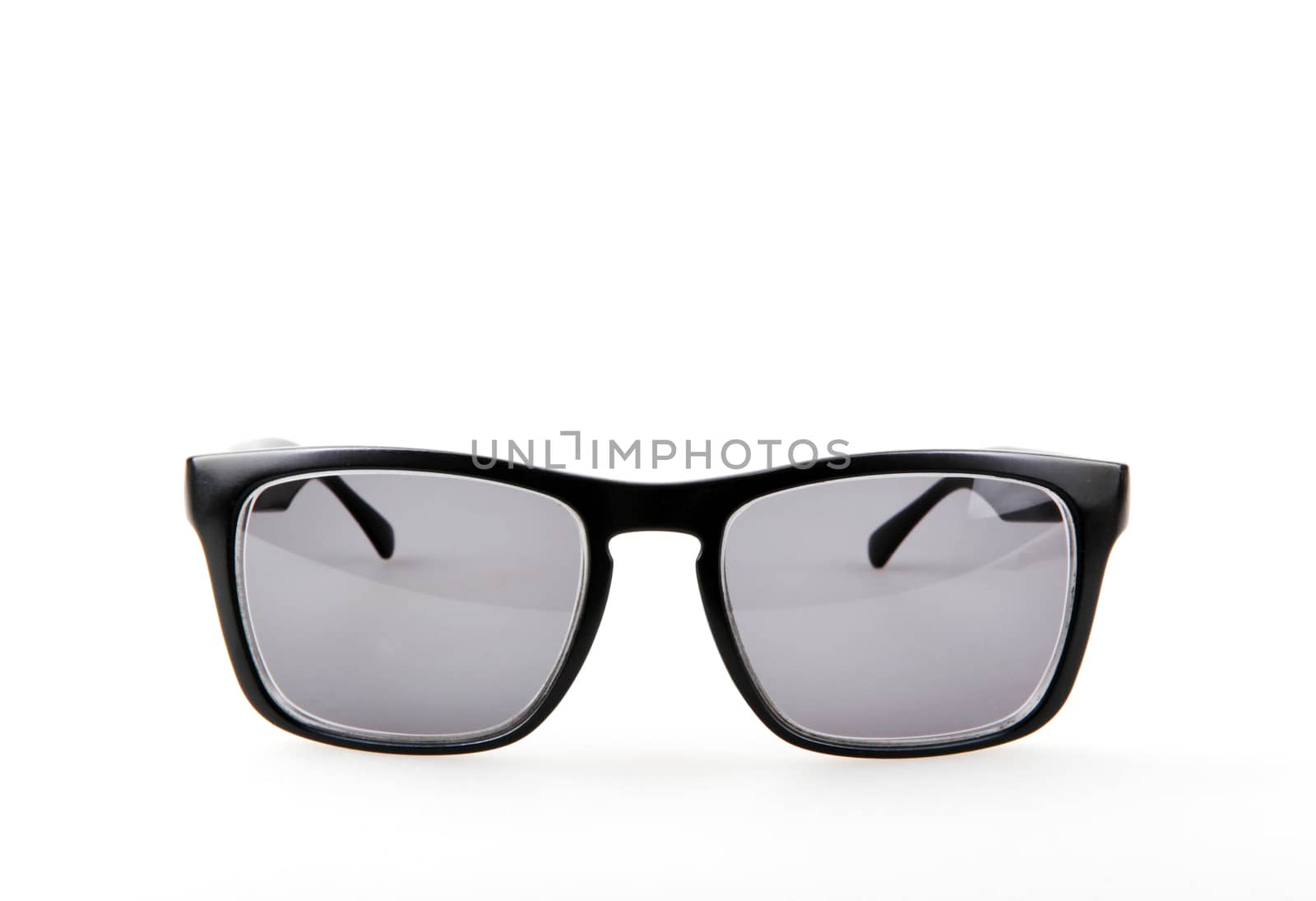 Close-Up Of Black Sunglasses Against White Background by nenovbrothers