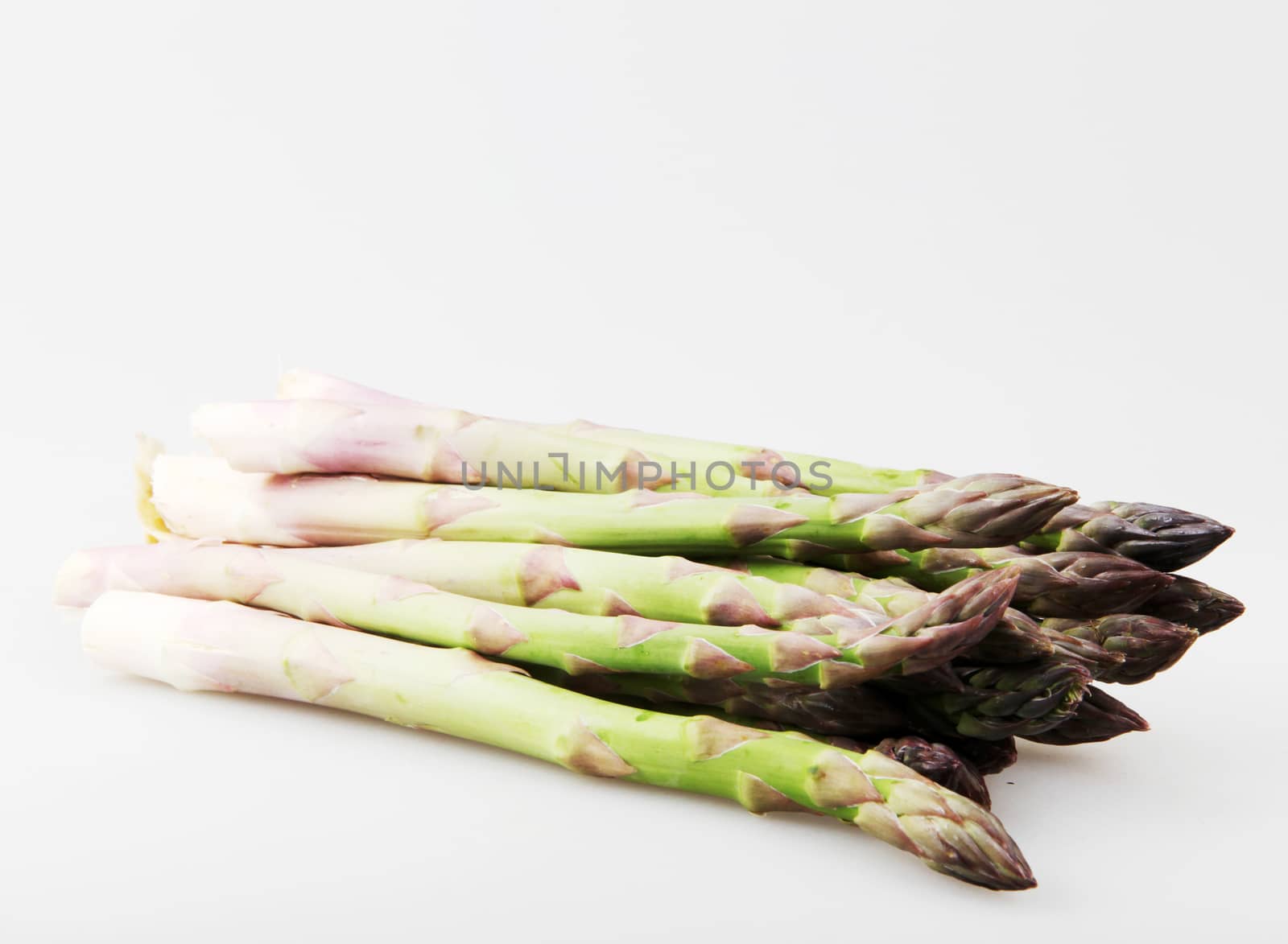 Close-Up Of Asparaguses Against White Background