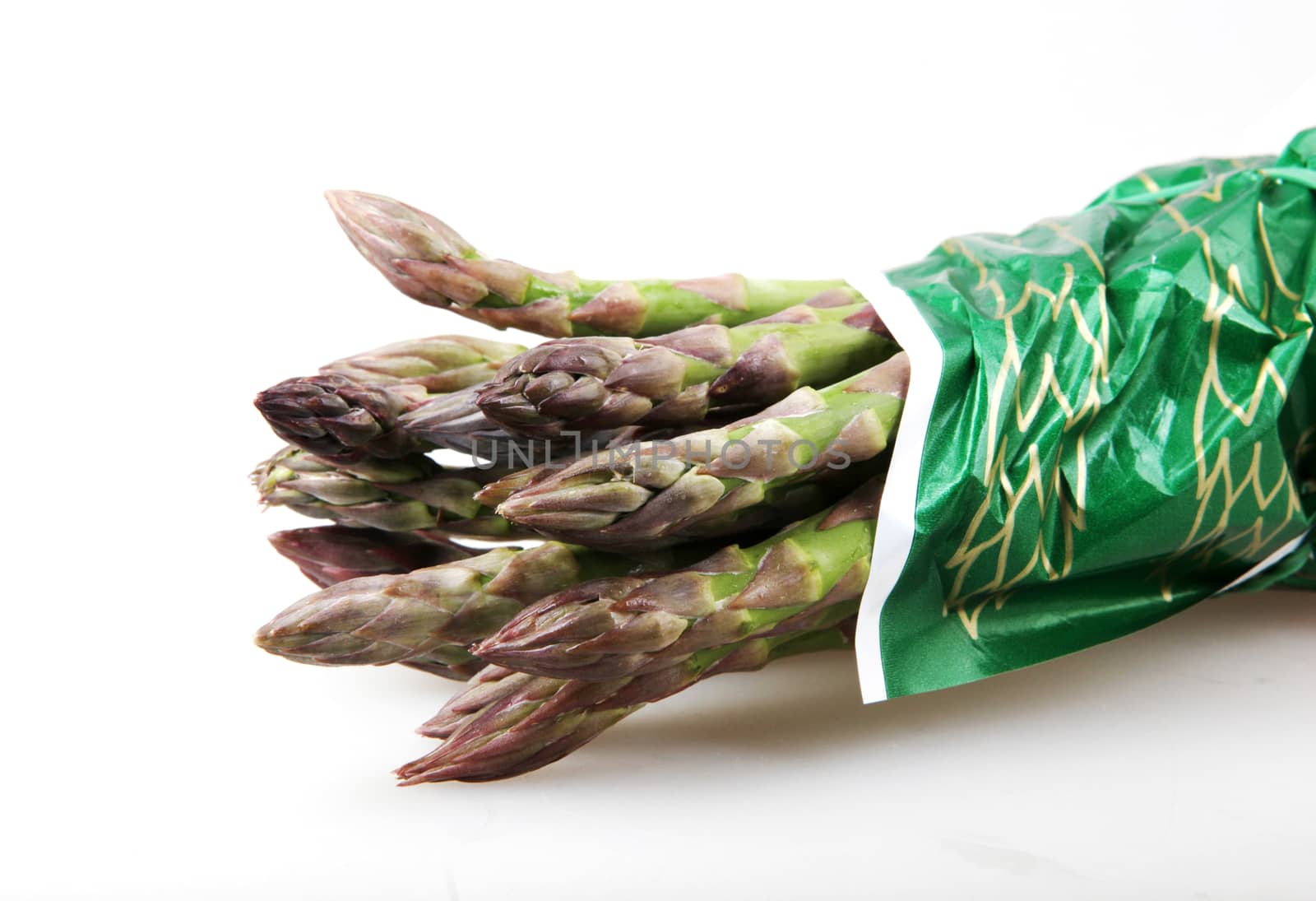 Close-Up Of Asparaguses Against White Background by nenovbrothers