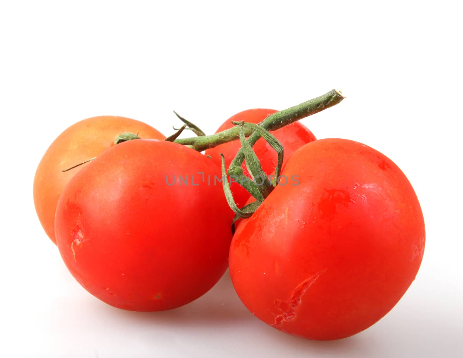 Close-Up Of Red Tomato On White Background