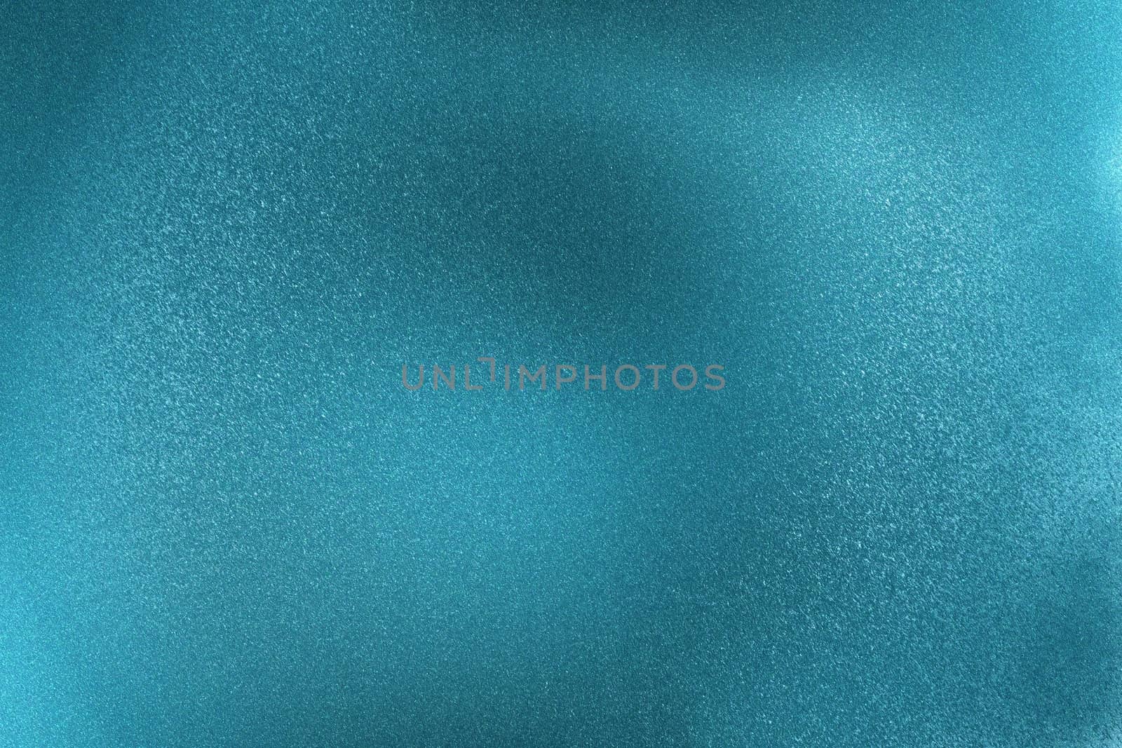 Glowing brushed blue metallic wall surface, abstract texture background