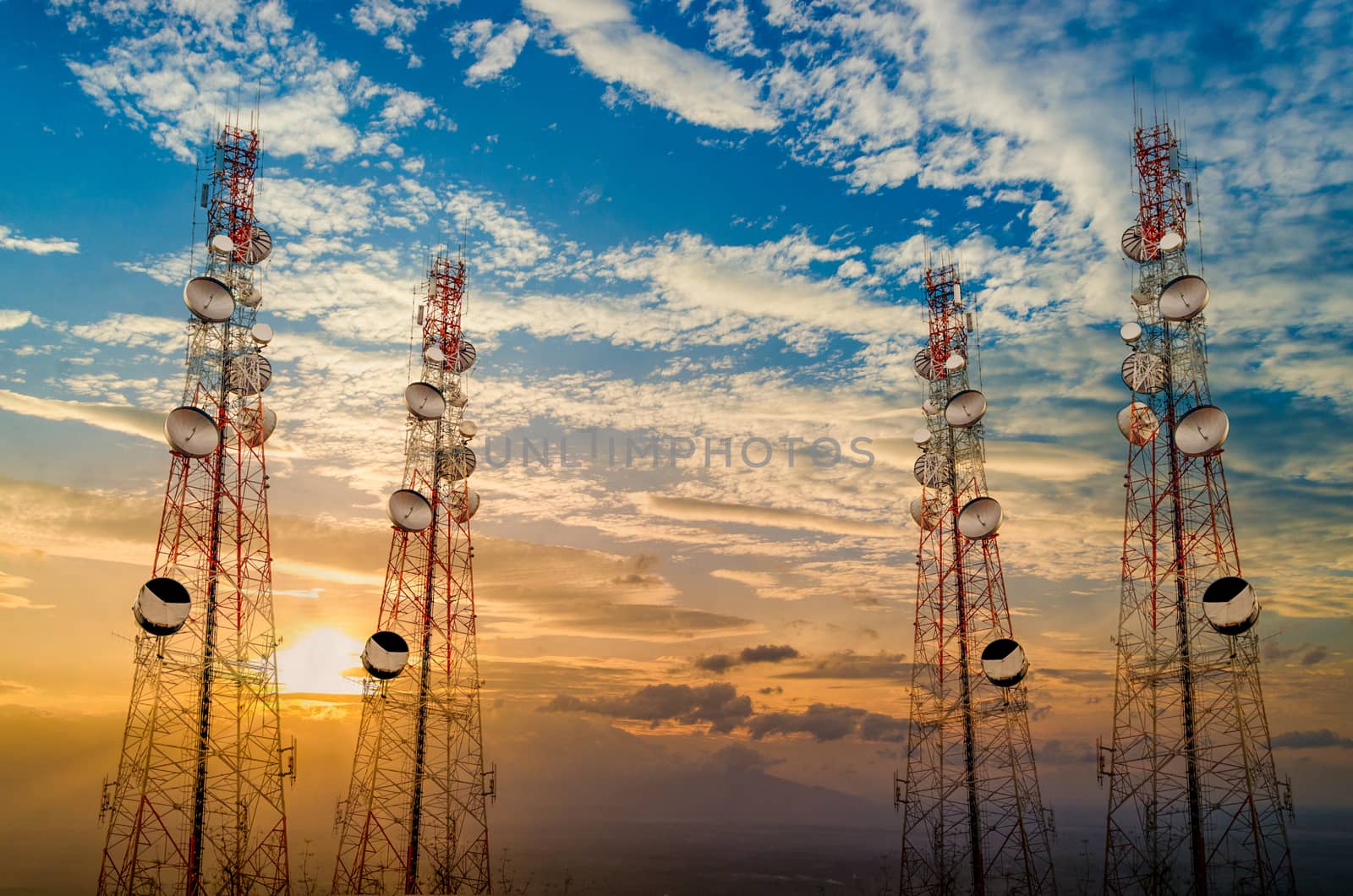 Telecommunication tower antenna in morning sky Evening sky by sarayut_thaneerat