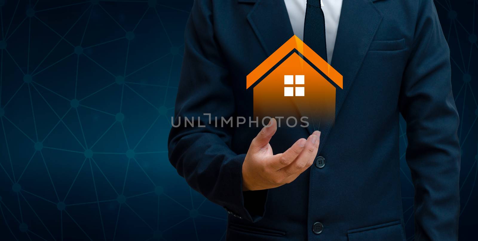 The house is in the hands of the business man  home icon or symbol Concept of home automation home applications and future by sarayut_thaneerat
