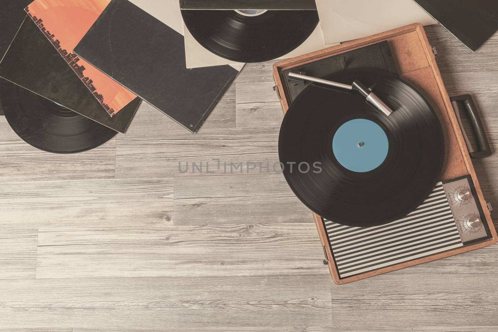 Vintage gramophone on gray wooden  by Robertobinetti70