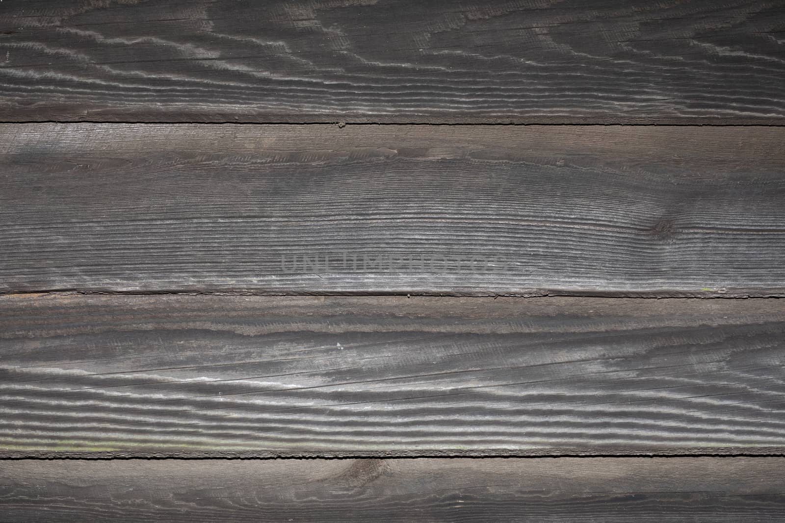 Exterior view of weathered, unpainted barn board. Background or texture source.