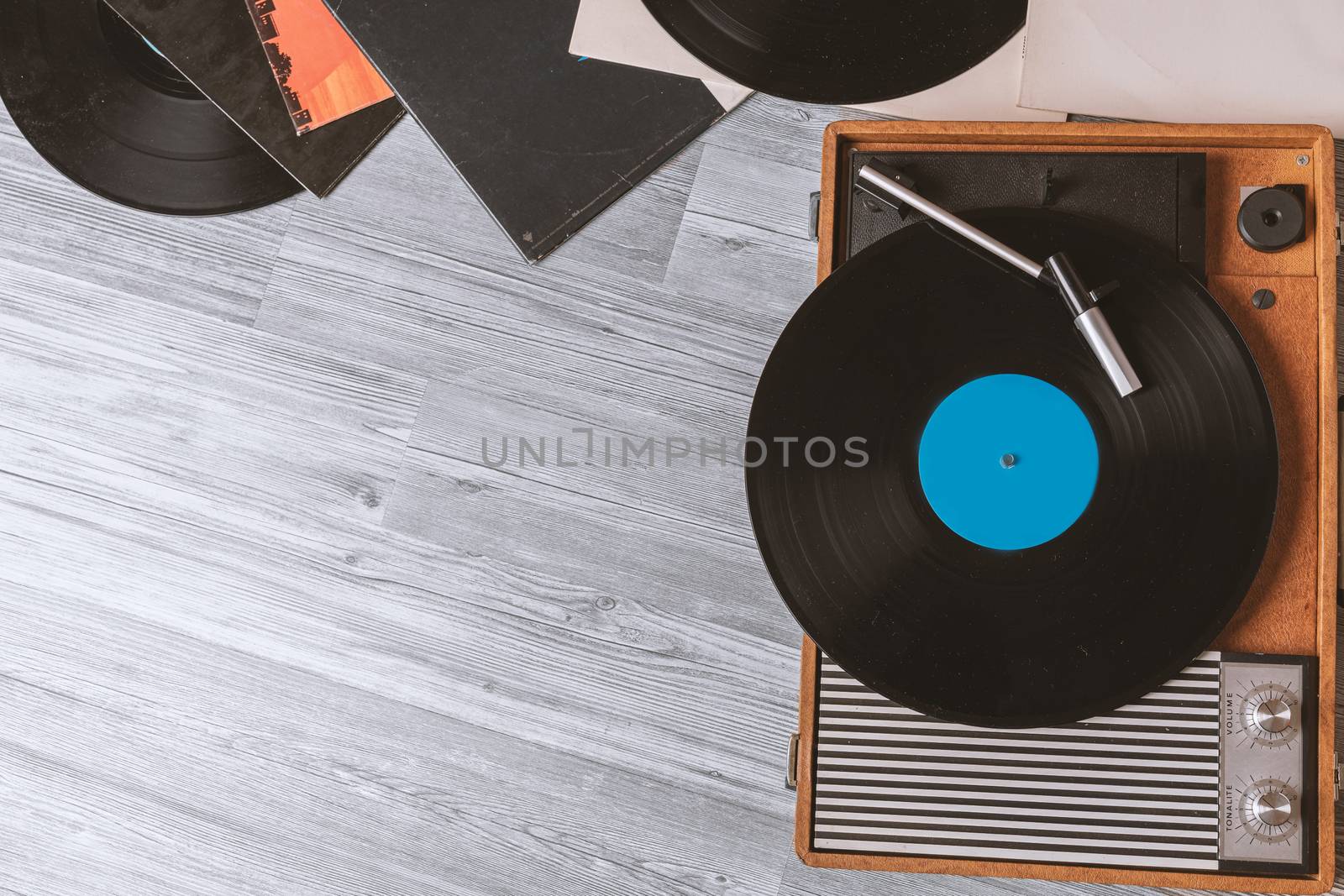 Gramophone on gray wooden table by Robertobinetti70